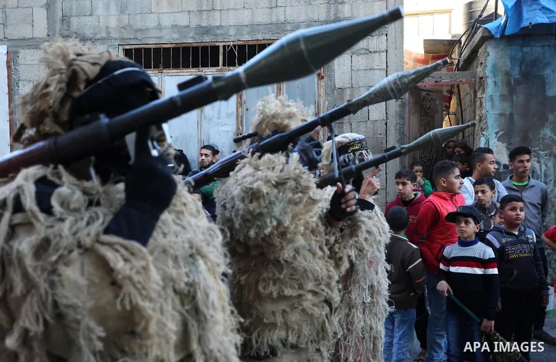 Palestinian militants from the Al-Quds Brigades, the armed wing of the Islamic Jihad movement, take part in a military parade, in Khan younis in the southern Gaza strip, on March 4, 2017. Photo by Ashraf Amra
