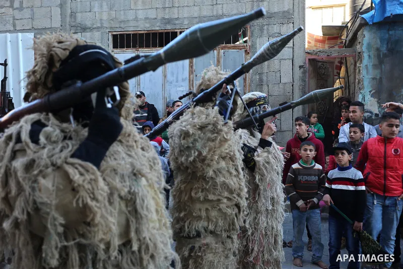 Palestinian militants from the Al-Quds Brigades, the armed wing of the Islamic Jihad movement, take part in a military parade, in Khan younis in the southern Gaza strip, on March 4, 2017. Photo by Ashraf Amra