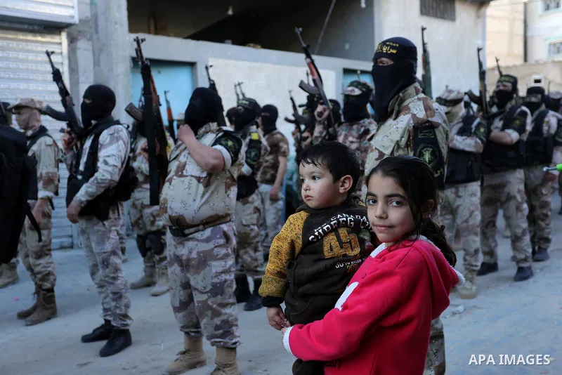 Palestinian militants from the Al-Quds Brigades, the armed wing of the Islamic Jihad movement, take part in a military parade, in Khan younis in the southern Gaza strip, on March 4, 2017. Photo by Ashraf Amra