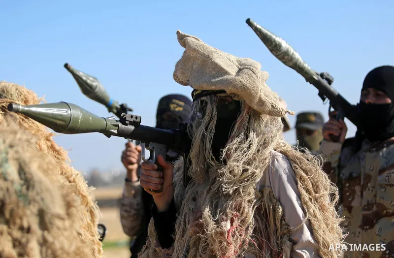 Palestinian militants from the Al-Quds Brigades, the armed wing of the Islamic Jihad movement, take part in a military parade, in Khan younis in the southern Gaza strip, on March 4, 2017. Photo by Ashraf Amra