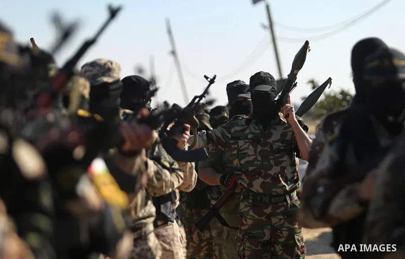Palestinian militants from the Al-Quds Brigades, the armed wing of the Islamic Jihad movement, take part in a military parade, in Khan younis in the southern Gaza strip, on March 4, 2017. Photo by Ashraf Amra