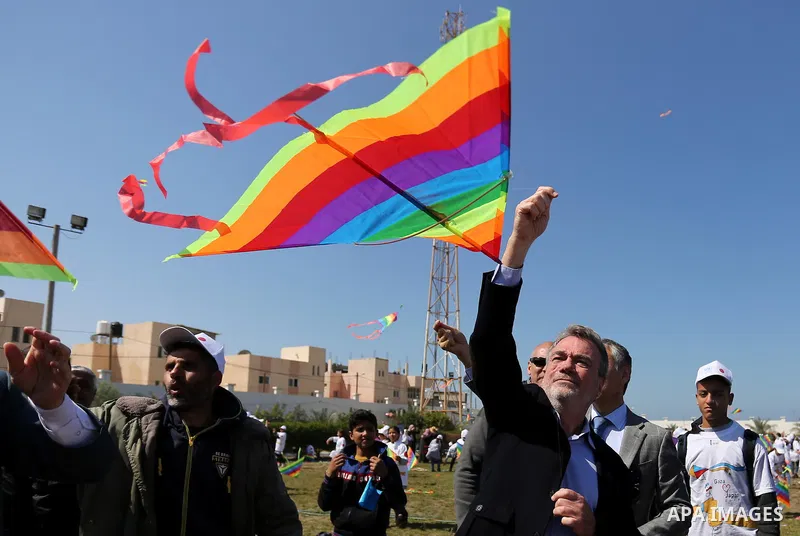 Bo Schack, director of United Nations Relief and Works Agency operations in Gaza, and Japanese ambassador Takeshi Okubo fly kites during an event organised by the United Nations Relief and Works Agency (UNRWA) to mark th...