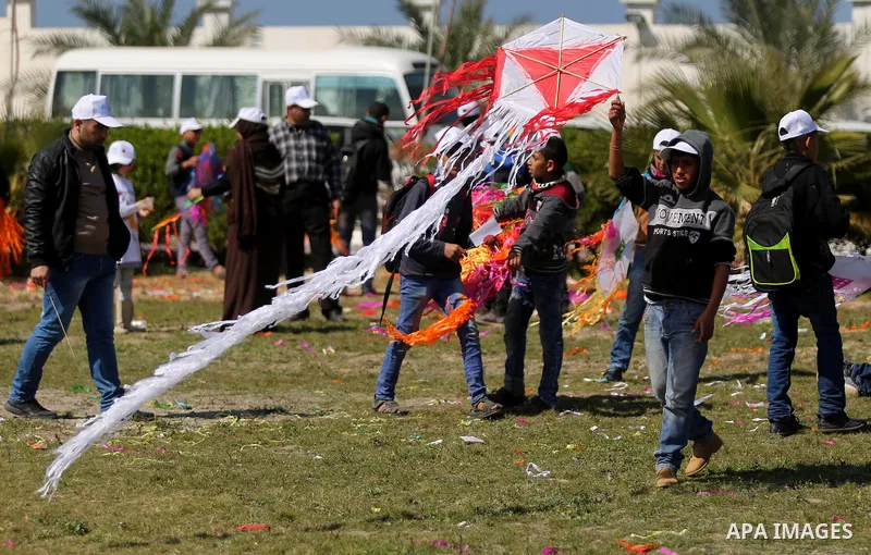 Palestinian schoolboys fly kites to show solidarity with the Japanese people during an event organised by the United Nations Relief and Works Agency (UNRWA) to mark the the sixth anniversary of the Tohoku earthquake and...