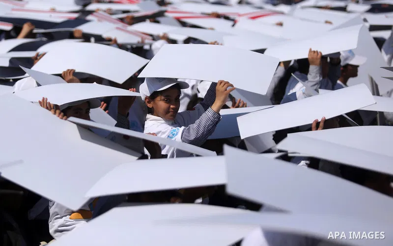 Palestinian schoolgirls fly kites to show solidarity with the Japanese people during an event organised by the United Nations Relief and Works Agency (UNRWA) to mark the the sixth anniversary of the Tohoku earthquake and...