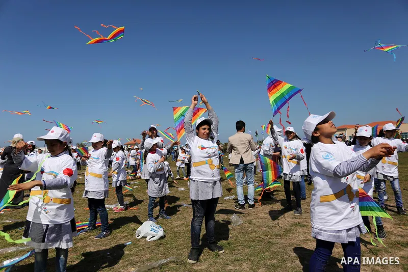 Palestinian schoolgirls fly kites to show solidarity with the Japanese people during an event organised by the United Nations Relief and Works Agency (UNRWA) to mark the the sixth anniversary of the Tohoku earthquake and...