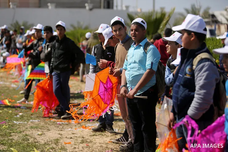 Palestinian schoolboys fly kites to show solidarity with the Japanese people during an event organised by the United Nations Relief and Works Agency (UNRWA) to mark the the sixth anniversary of the Tohoku earthquake and...