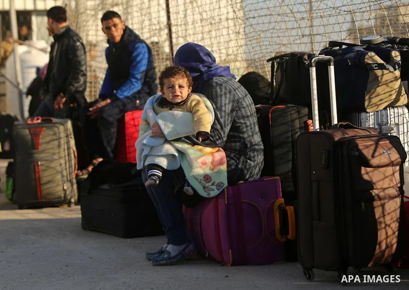 Palestinians wait for travel permits to cross into Egypt through the Rafah border crossing after it was opened by Egyptian authorities for humanitarian cases, in Rafah in the southern Gaza Strip on March 6, 2017. Photo b...