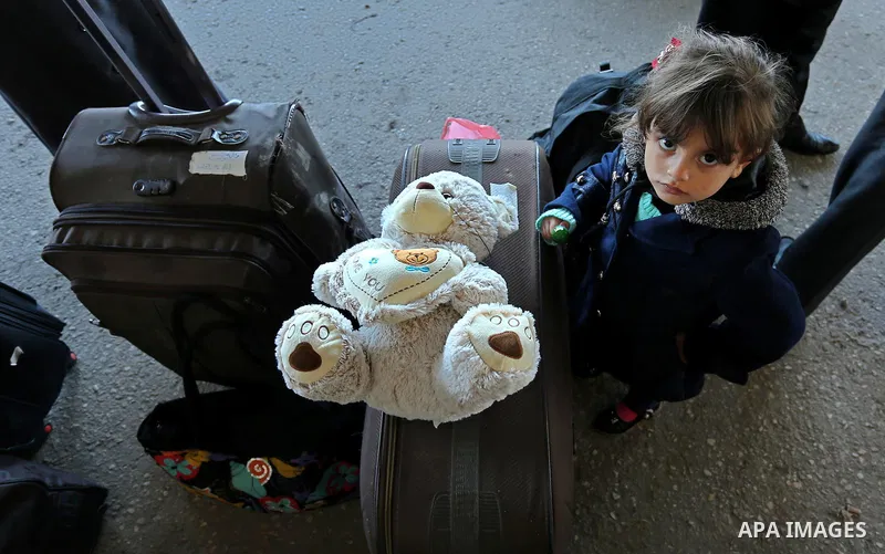 Palestinians wait for travel permits to cross into Egypt through the Rafah border crossing after it was opened by Egyptian authorities for humanitarian cases, in Rafah in the southern Gaza Strip on March 6, 2017. Photo b...