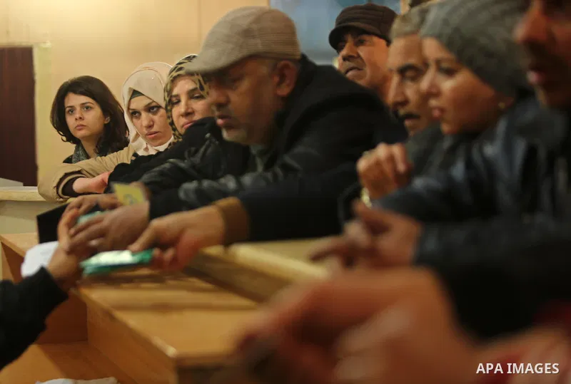 Palestinians wait for travel permits to cross into Egypt through the Rafah border crossing after it was opened by Egyptian authorities for humanitarian cases, in Rafah in the southern Gaza Strip on March 6, 2017. Photo b...