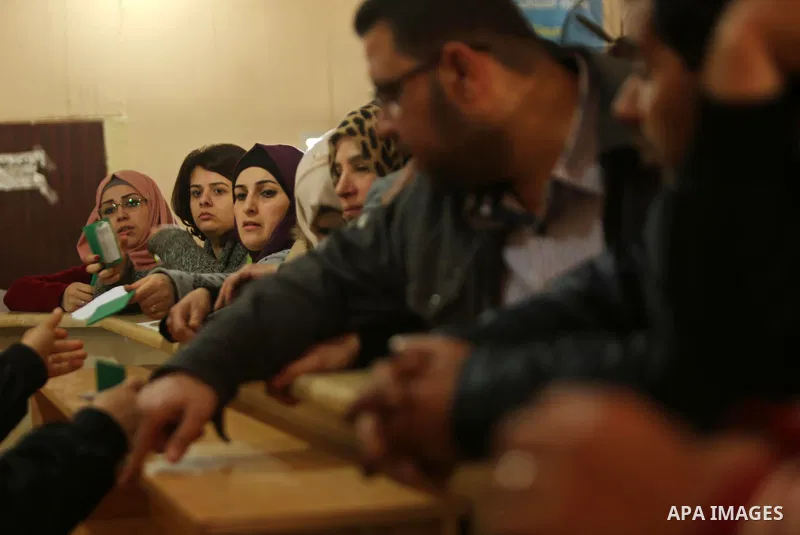 Palestinians wait for travel permits to cross into Egypt through the Rafah border crossing after it was opened by Egyptian authorities for humanitarian cases, in Rafah in the southern Gaza Strip on March 6, 2017. Photo b...