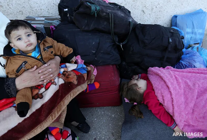 Palestinians wait for travel permits to cross into Egypt through the Rafah border crossing after it was opened by Egyptian authorities for humanitarian cases, in Rafah in the southern Gaza Strip on March 6, 2017. Photo b...