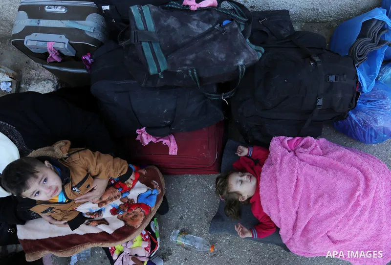 Palestinians wait for travel permits to cross into Egypt through the Rafah border crossing after it was opened by Egyptian authorities for humanitarian cases, in Rafah in the southern Gaza Strip on March 6, 2017. Photo b...