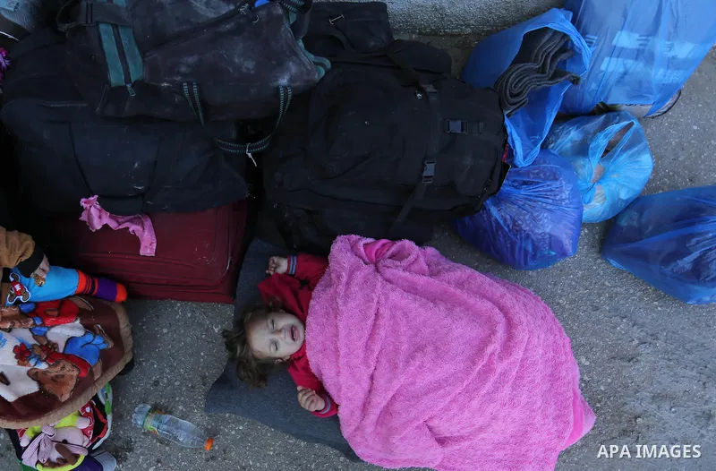 Palestinians wait for travel permits to cross into Egypt through the Rafah border crossing after it was opened by Egyptian authorities for humanitarian cases, in Rafah in the southern Gaza Strip on March 6, 2017. Photo b...