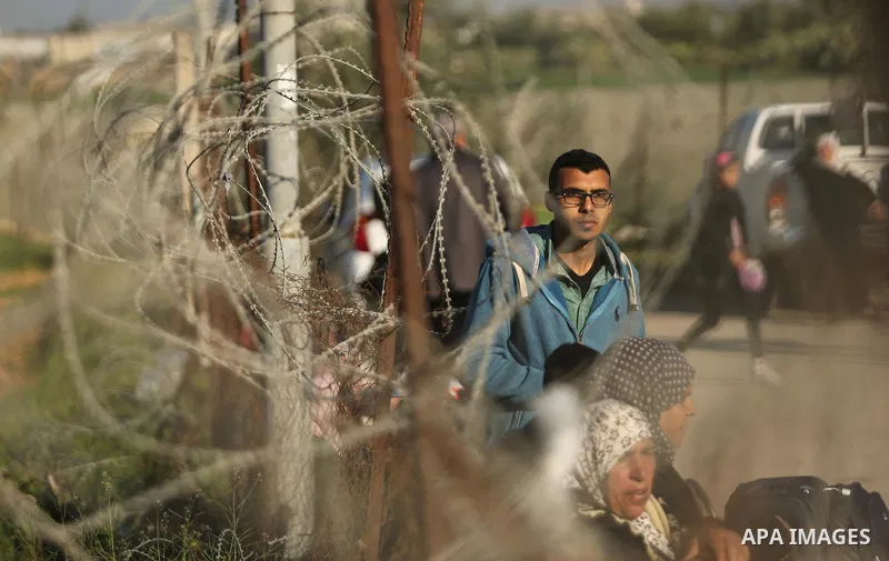 Palestinians wait for travel permits to cross into Egypt through the Rafah border crossing after it was opened by Egyptian authorities for humanitarian cases, in Rafah in the southern Gaza Strip on March 6, 2017. Photo b...