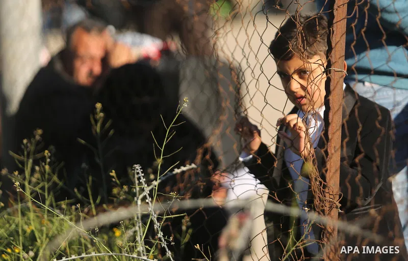 Palestinians wait for travel permits to cross into Egypt through the Rafah border crossing after it was opened by Egyptian authorities for humanitarian cases, in Rafah in the southern Gaza Strip on March 6, 2017. Photo b...