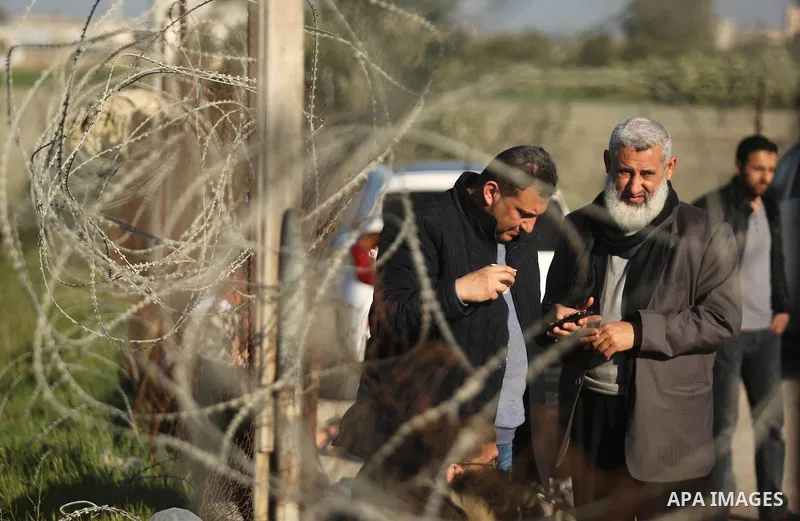 Palestinians wait for travel permits to cross into Egypt through the Rafah border crossing after it was opened by Egyptian authorities for humanitarian cases, in Rafah in the southern Gaza Strip on March 6, 2017. Photo b...