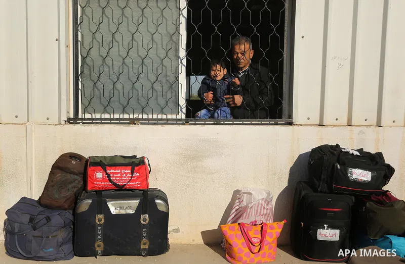 Palestinians wait for travel permits to cross into Egypt through the Rafah border crossing after it was opened by Egyptian authorities for humanitarian cases, in Rafah in the southern Gaza Strip on March 6, 2017. Photo b...