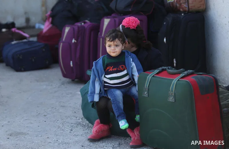 Palestinians wait for travel permits to cross into Egypt through the Rafah border crossing after it was opened by Egyptian authorities for humanitarian cases, in Rafah in the southern Gaza Strip on March 6, 2017. Photo b...