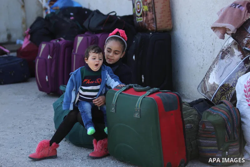 Palestinians wait for travel permits to cross into Egypt through the Rafah border crossing after it was opened by Egyptian authorities for humanitarian cases, in Rafah in the southern Gaza Strip on March 6, 2017. Photo b...