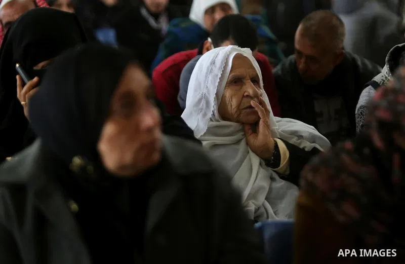 Palestinians wait for travel permits to cross into Egypt through the Rafah border crossing after it was opened by Egyptian authorities for humanitarian cases, in Rafah in the southern Gaza Strip on March 7, 2017. Photo b...