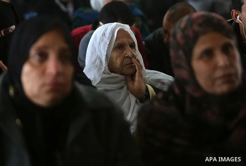 Palestinians wait for travel permits to cross into Egypt through the Rafah border crossing after it was opened by Egyptian authorities for humanitarian cases, in Rafah in the southern Gaza Strip on March 7, 2017. Photo b...