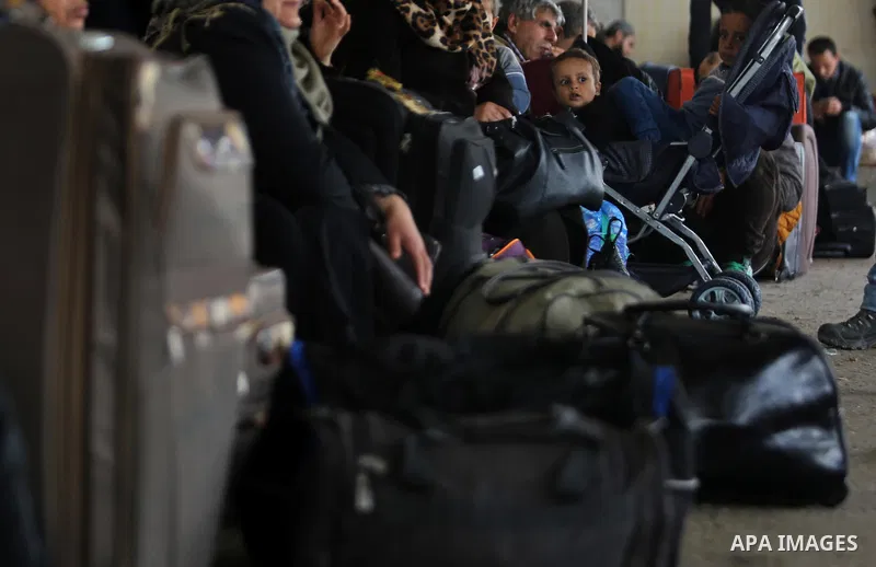 Palestinians wait for travel permits to cross into Egypt through the Rafah border crossing after it was opened by Egyptian authorities for humanitarian cases, in Rafah in the southern Gaza Strip on March 7, 2017. Photo b...
