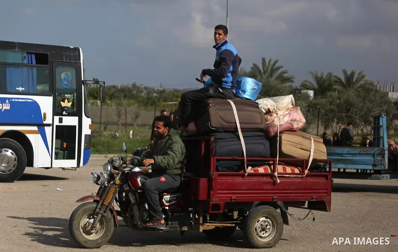 Palestinians wait for travel permits to cross into Egypt through the Rafah border crossing after it was opened by Egyptian authorities for humanitarian cases, in Rafah in the southern Gaza Strip on March 7, 2017. Photo b...