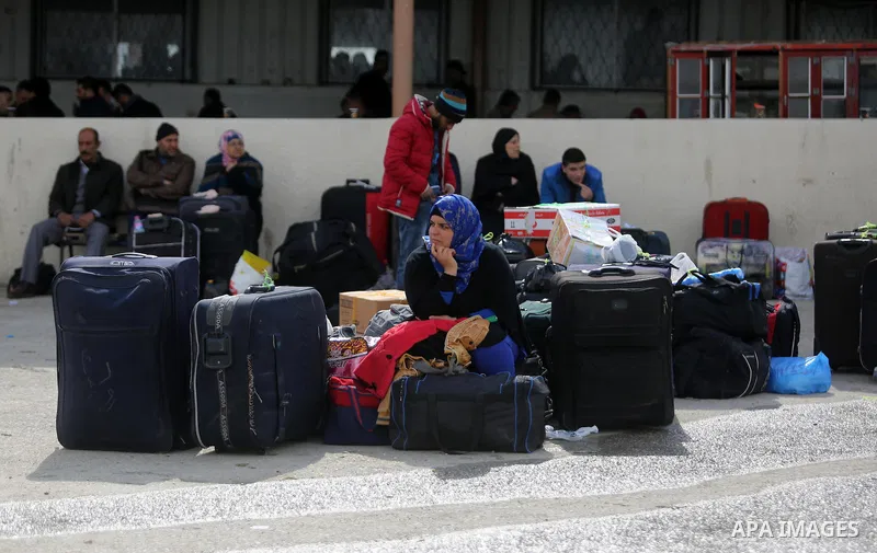 Palestinians wait for travel permits to cross into Egypt through the Rafah border crossing after it was opened by Egyptian authorities for humanitarian cases, in Rafah in the southern Gaza Strip on March 7, 2017. Photo b...