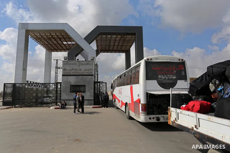 Palestinians wait for travel permits to cross into Egypt through the Rafah border crossing after it was opened by Egyptian authorities for humanitarian cases, in Rafah in the southern Gaza Strip on March 7, 2017. Photo b...