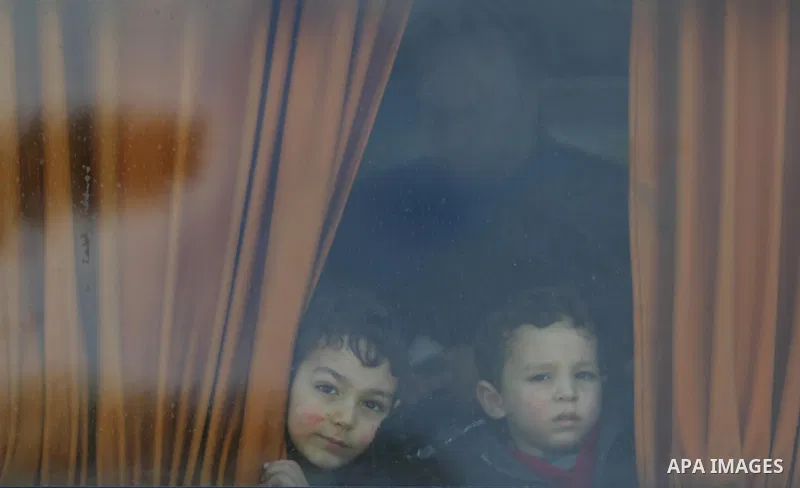 Palestinians wait for travel permits to cross into Egypt through the Rafah border crossing after it was opened by Egyptian authorities for humanitarian cases, in Rafah in the southern Gaza Strip on March 7, 2017. Photo b...