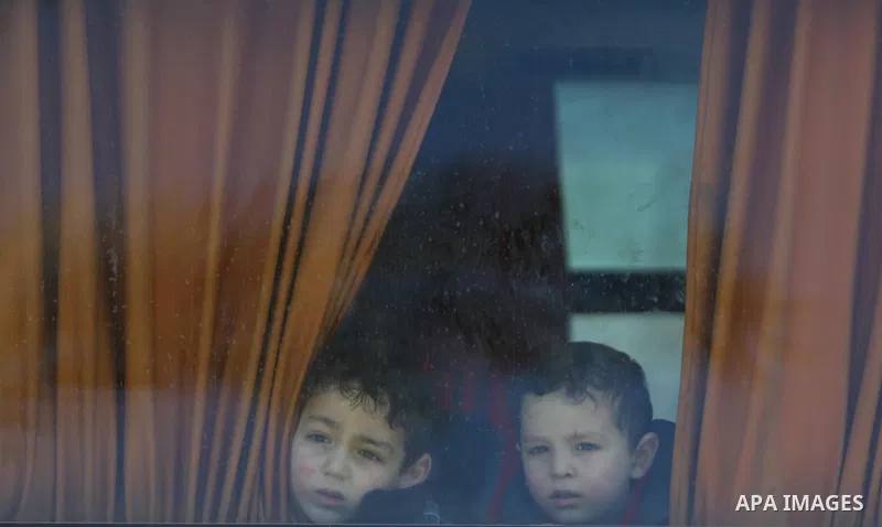 Palestinians wait for travel permits to cross into Egypt through the Rafah border crossing after it was opened by Egyptian authorities for humanitarian cases, in Rafah in the southern Gaza Strip on March 7, 2017. Photo b...