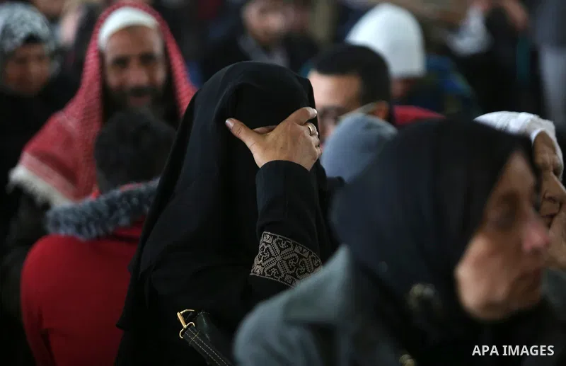 Palestinians wait for travel permits to cross into Egypt through the Rafah border crossing after it was opened by Egyptian authorities for humanitarian cases, in Rafah in the southern Gaza Strip on March 7, 2017. Photo b...