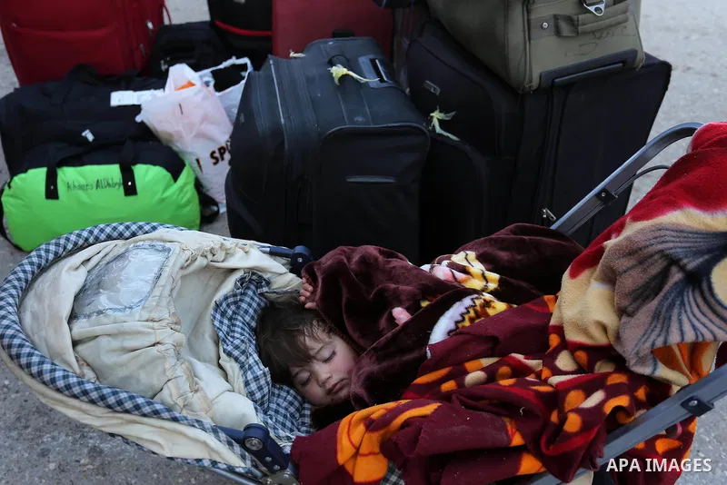 Palestinians wait for travel permits to cross into Egypt through the Rafah border crossing after it was opened by Egyptian authorities for humanitarian cases, in Rafah in the southern Gaza Strip on March 7, 2017. Photo b...