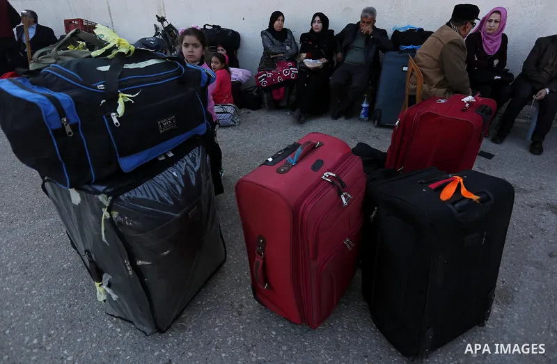 Palestinians wait for travel permits to cross into Egypt through the Rafah border crossing after it was opened by Egyptian authorities for humanitarian cases, in Rafah in the southern Gaza Strip on March 7, 2017. Photo b...