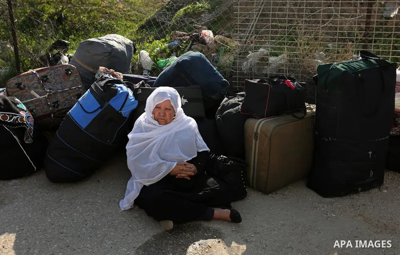 Palestinians wait for travel permits to cross into Egypt through the Rafah border crossing after it was opened by Egyptian authorities for humanitarian cases, in Rafah in the southern Gaza Strip on March 7, 2017. Photo b...