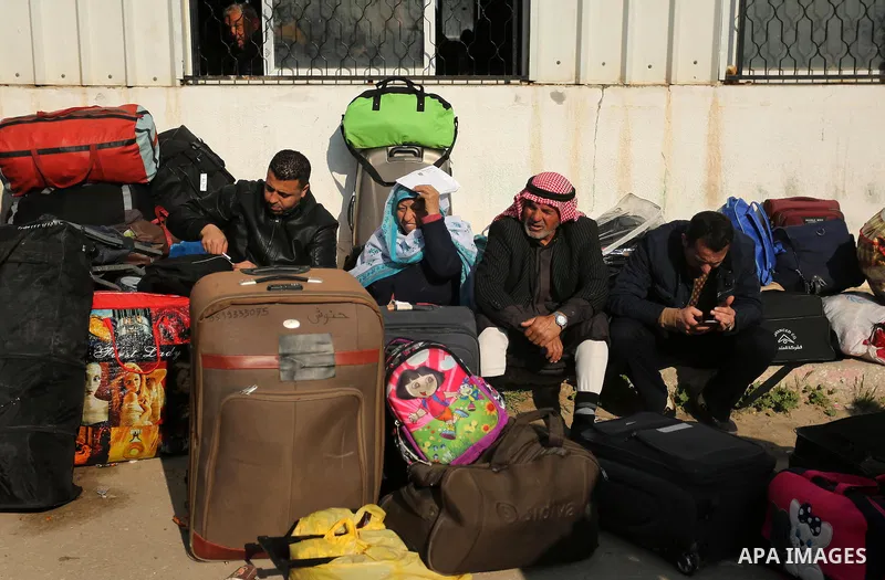 Palestinians wait for travel permits to cross into Egypt through the Rafah border crossing after it was opened by Egyptian authorities for humanitarian cases, in Rafah in the southern Gaza Strip on March 7, 2017. Photo b...