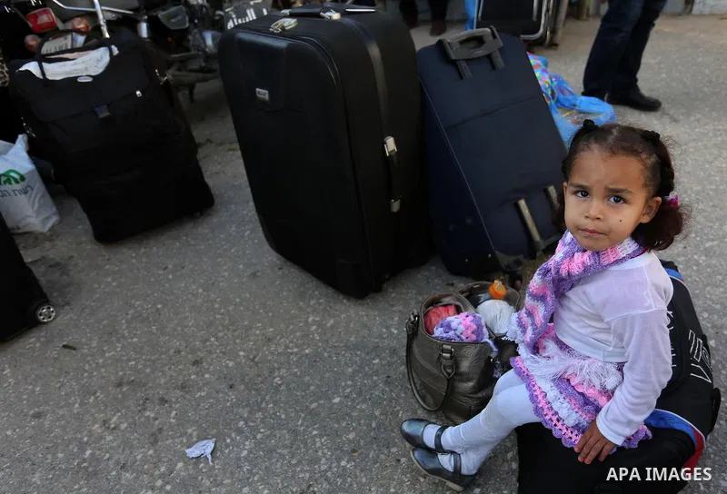 Palestinians wait for travel permits to cross into Egypt through the Rafah border crossing after it was opened by Egyptian authorities for humanitarian cases, in Rafah in the southern Gaza Strip on March 7, 2017. Photo b...