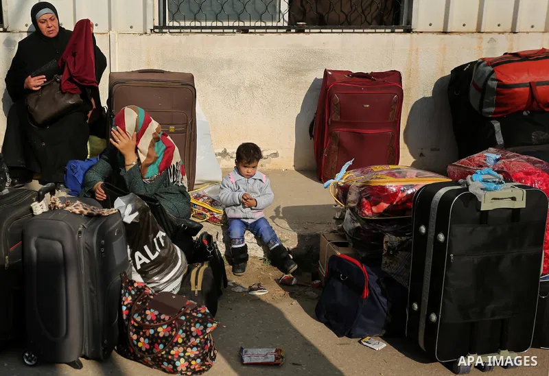 Palestinians wait for travel permits to cross into Egypt through the Rafah border crossing after it was opened by Egyptian authorities for humanitarian cases, in Rafah in the southern Gaza Strip on March 7, 2017. Photo b...