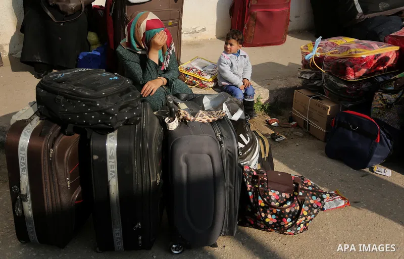 Palestinians wait for travel permits to cross into Egypt through the Rafah border crossing after it was opened by Egyptian authorities for humanitarian cases, in Rafah in the southern Gaza Strip on March 7, 2017. Photo b...