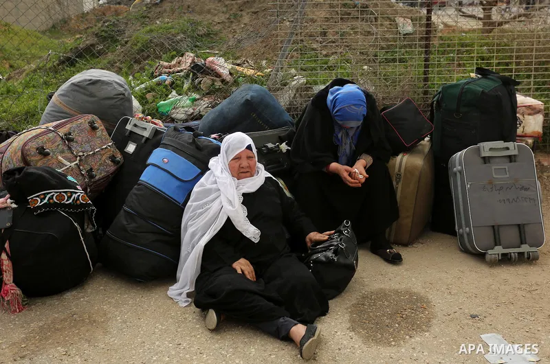 Palestinians wait for travel permits to cross into Egypt through the Rafah border crossing after it was opened by Egyptian authorities for humanitarian cases, in Rafah in the southern Gaza Strip on March 7, 2017. Photo b...
