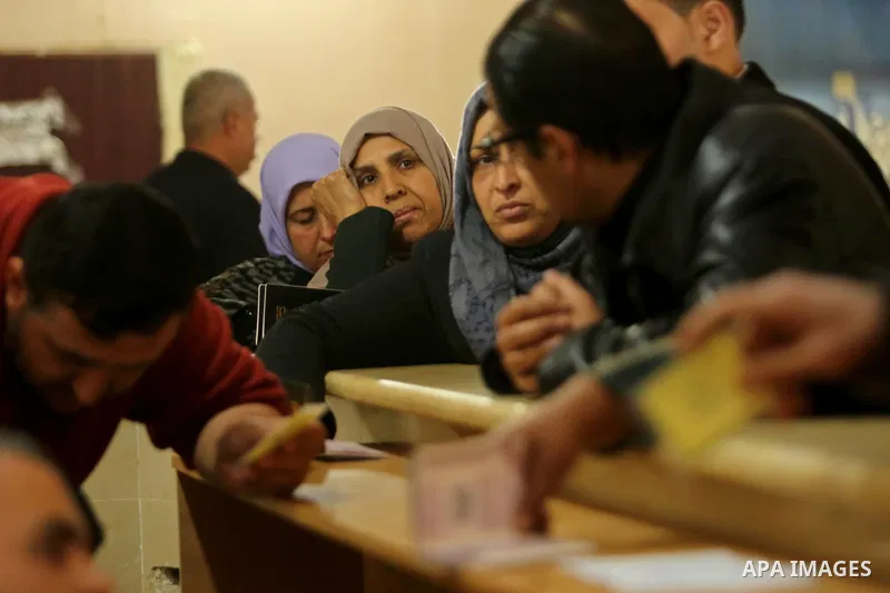 Palestinians wait for travel permits to cross into Egypt through the Rafah border crossing after it was opened by Egyptian authorities for humanitarian cases, in Rafah in the southern Gaza Strip on March 7, 2017. Photo b...