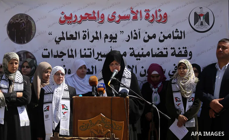 Palestinian women take part in a protest to show soldirity with Palestinian female prisoners in Israeli jails on the occasion of International Women's Day in Gaza City on March 7, 2017. Photo by Mohammed Asad