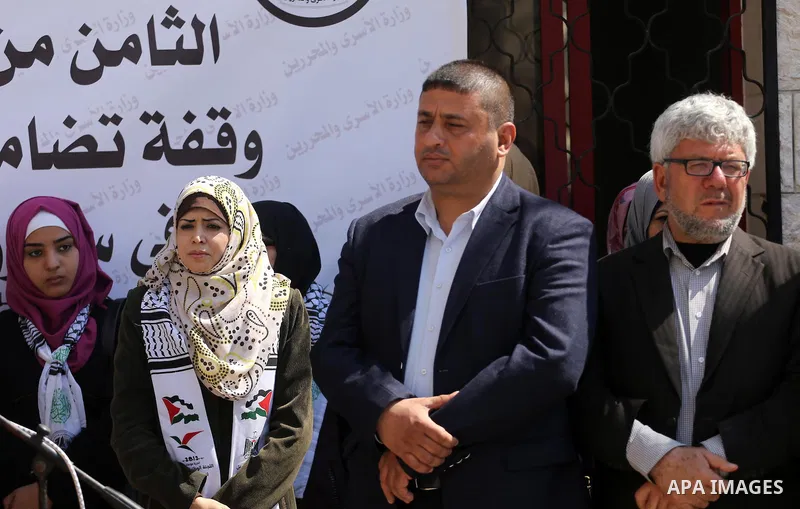 Palestinian women take part in a protest to show soldirity with Palestinian female prisoners in Israeli jails on the occasion of International Women's Day in Gaza City on March 7, 2017. Photo by Mohammed Asad