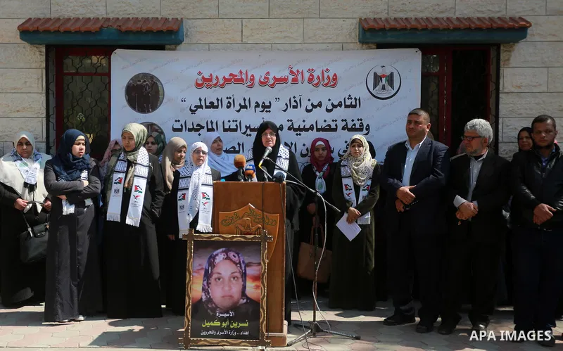 Palestinian women take part in a protest to show soldirity with Palestinian female prisoners in Israeli jails on the occasion of International Women's Day in Gaza City on March 7, 2017. Photo by Mohammed Asad