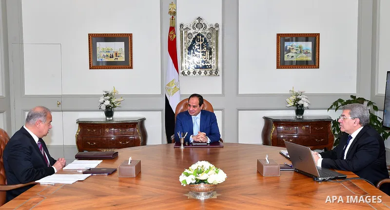 Egyptian President Abdelfattah Al-Sisi, meets with Prime Minister Ismail Sharif and Finance Minister Amr El Garhy, in Cairo, Egypt, Tuesday, March 7, 2017. Photo by Egyptian President Office