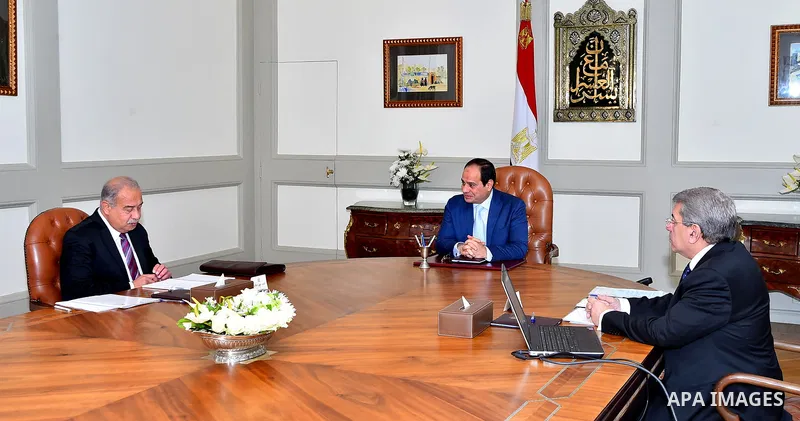 Egyptian President Abdelfattah Al-Sisi, meets with Prime Minister Ismail Sharif and Finance Minister Amr El Garhy, in Cairo, Egypt, Tuesday, March 7, 2017. Photo by Egyptian President Office