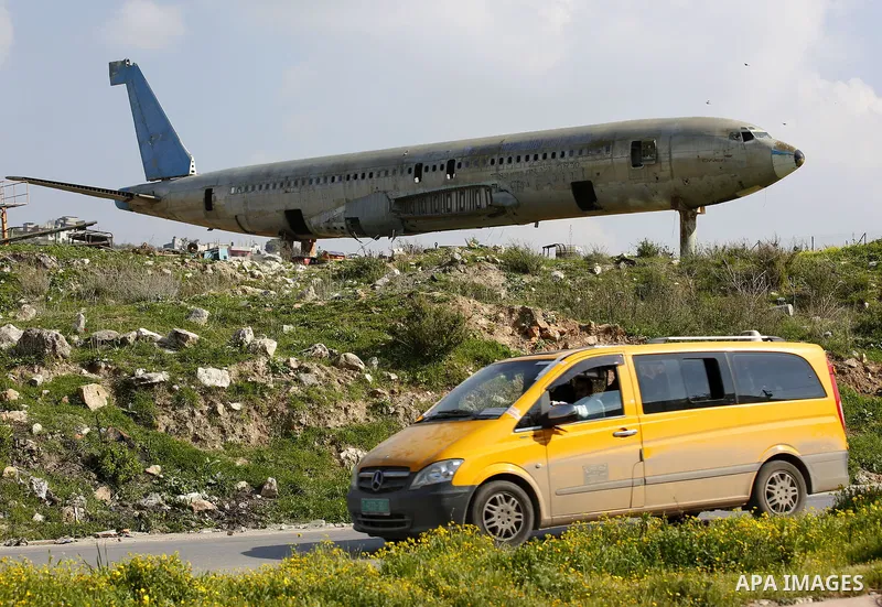 A retired Boeing airplane once belonging to an Israeli airline is seen in the west bank city of Nablus, on March 7, 2017. Photo by Wisam Hashlamoun