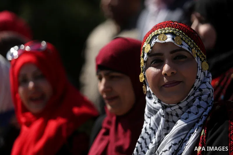 Palestinian women take part during a protest against violence towards women and demanding to end the Israeli occupation on International Women's Day, in Gaza city on March 08, 2017. Photo by Ashraf Amra