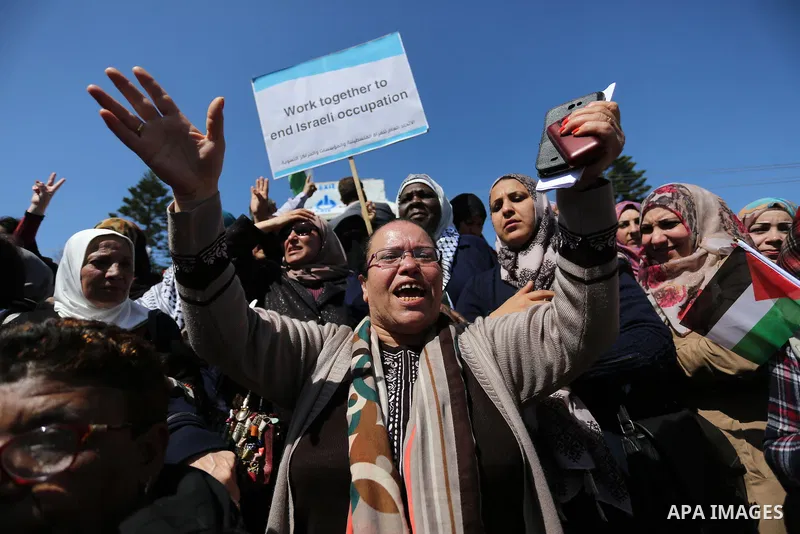 Palestinian women take part during a protest against violence towards women and demanding to end the Israeli occupation on International Women's Day, in Gaza city on March 08, 2017. Photo by Ashraf Amra