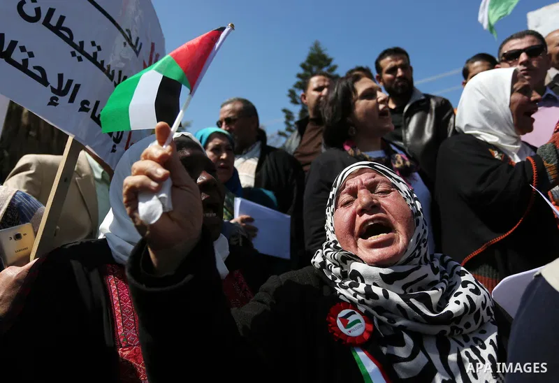 Palestinian women take part during a protest against violence towards women and demanding to end the Israeli occupation on International Women's Day, in Gaza city on March 08, 2017. Photo by Ashraf Amra